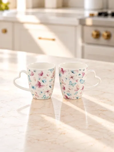 Dúo de tazas Mariposas con asas de corazón